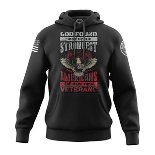 "Image shows black hoodie featuring the bold, patriotic phrase 'God Found Some Of The Strongest American And Made Them Veterans."