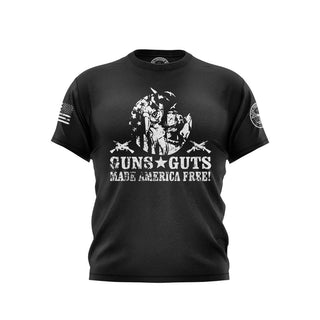 "Black T-shirt featuring 'Gyns & Guts made America Free' text with patriotic graphics."