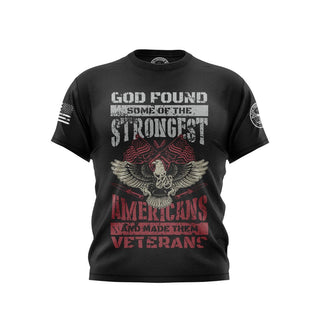 "Black T-shirt featuring 'God Found Some Of The Strongest Americans' text with patriotic graphics."